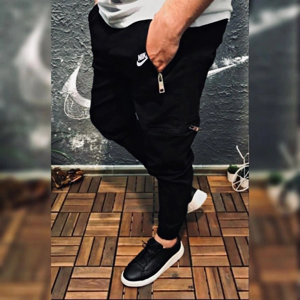 Name : NIKE JOGGER SIZE :  M-30, M-28/30, L-32, XL-34, XXL-36  Product Details :*Brand - Nike*  showroom ARTICLE 🔥🔥🔥🔥*Lycra 4 by 4 Fabric Comfortable 👌🏻**Very Premium Quality* *10Aquality**check Size-M28-30,L32,XL34,XXL36*Colours- *Black & Olive* Free Ship ☺️* Both Side Pocket  with bottom grip *Quality  Fully Guaranteed 💯*full stock available take open Orders Avl *365 Days 
