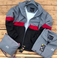 *Very Premium Quality UNDER ARMOUR WINDCHEATER*😍🎉*New New New feature*🎉 👉*Top quality light weight Windcheater with *inbuilt water resistant carry bag**Brand - UNDER ARMOUR**WIND BREAKER &  FULLY WATERPROOF FABRIC*👉IMPORTED TPU FABRIC👉INSIDE NET*PREMIUM QUALITY**SIZES M38, L40, XL42, XXL44**LATEST SHOWROOM ARTICLE** FS**Note: pls don’t compare with cheap quality market prod