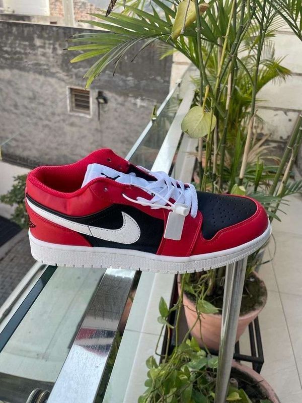 Red leather best sale nike shoes