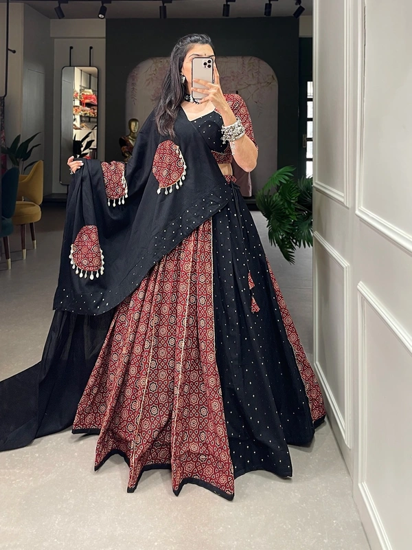 Antique Fashion 1 Presenting to you our latest masterpiece of navratri collection. Dress up into this printed new maroon color and the mirror work chaniya choli  to a create your garba look more significant 🖤