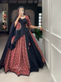 Antique Fashion 1 Presenting to you our latest masterpiece of navratri collection. Dress up into this printed new maroon color and the mirror work chaniya choli  to a create your garba look more significant 🖤