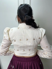 Antique Fashion 1 Steal the spotlight by adoring this wine lehenga in  pure cotton  material embellished with Lucknowi work also featured with beautiful hand made heavy tassels 