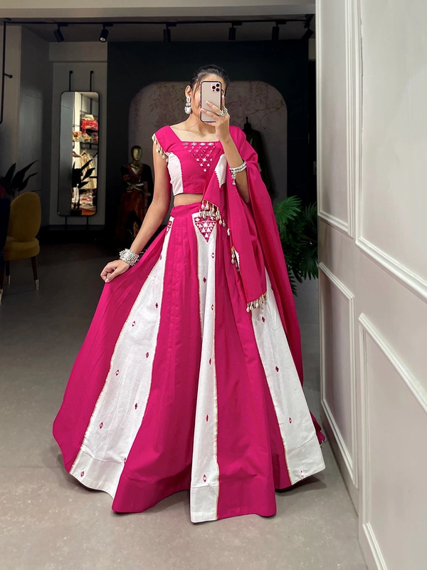 Antique Fashion  This lehenga is crafted with intricate mirror work and adorned with cowrie work lace details adding a touch of blended pink and white color to create best navratri look for you   - pink