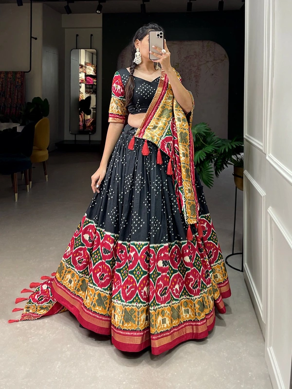 Antique Fashion  Step into the world of sheer Tussar Silk with Patola Print magic with these stunning lehenga! 💫 - Black