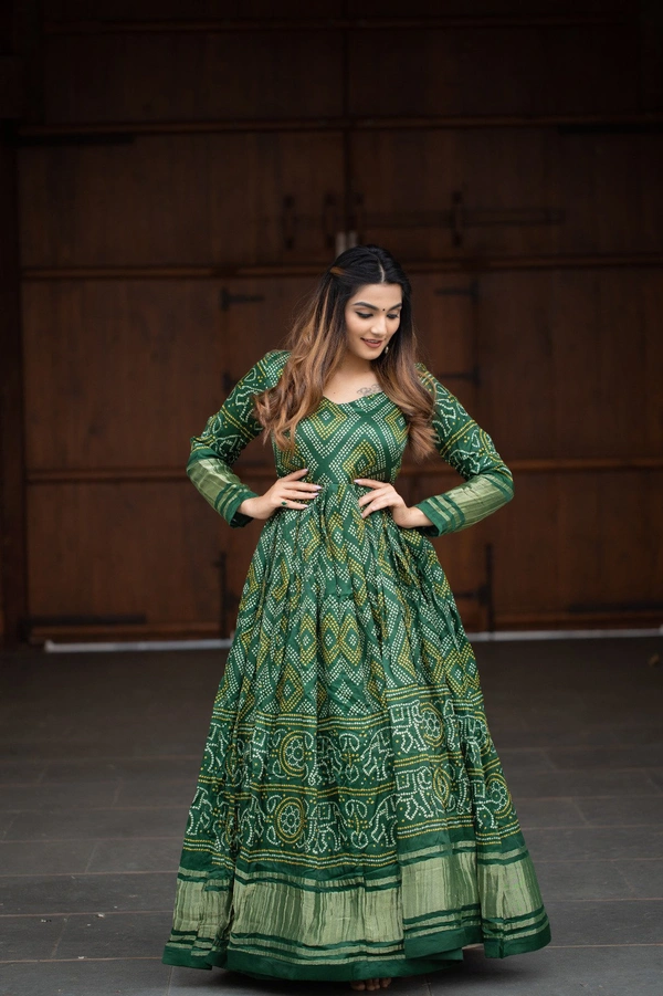Antique Fashion  Presenting a perfectly blended endless array of patterns, designs and  colors , that represents a vibrant indian culture & true essence of our traditional gaji silk bandhej gown. - green