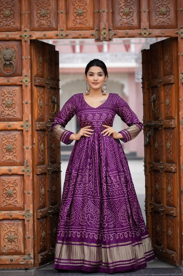 Antique Fashion 1 Presenting a perfectly blended endless array of patterns, designs and  colors , that represents a vibrant indian culture & true essence of our traditional gaji silk bandhej gown. - wine