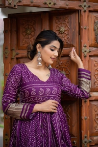 Antique Fashion 1 Presenting a perfectly blended endless array of patterns, designs and  colors , that represents a vibrant indian culture & true essence of our traditional gaji silk bandhej gown. - wine