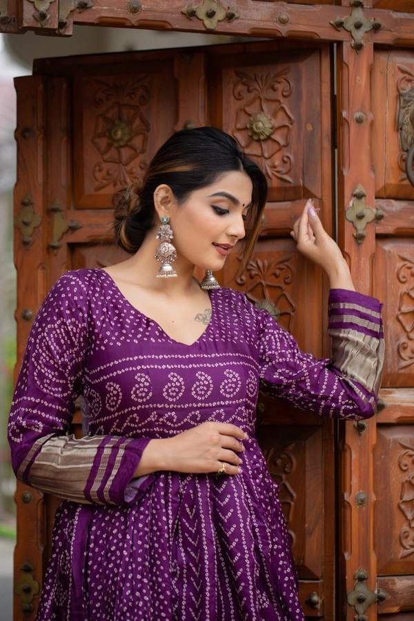 Antique Fashion 1 Presenting a perfectly blended endless array of patterns, designs and  colors , that represents a vibrant indian culture & true essence of our traditional gaji silk bandhej gown. - wine