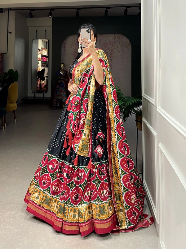 Antique Fashion  Step into the world of sheer Tussar Silk with Patola Print magic with these stunning lehenga! 💫 - Black