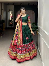 Antique Fashion 1 Step into the world of sheer Tussar Silk with Patola Print magic with these stunning lehenga! 💫 - green
