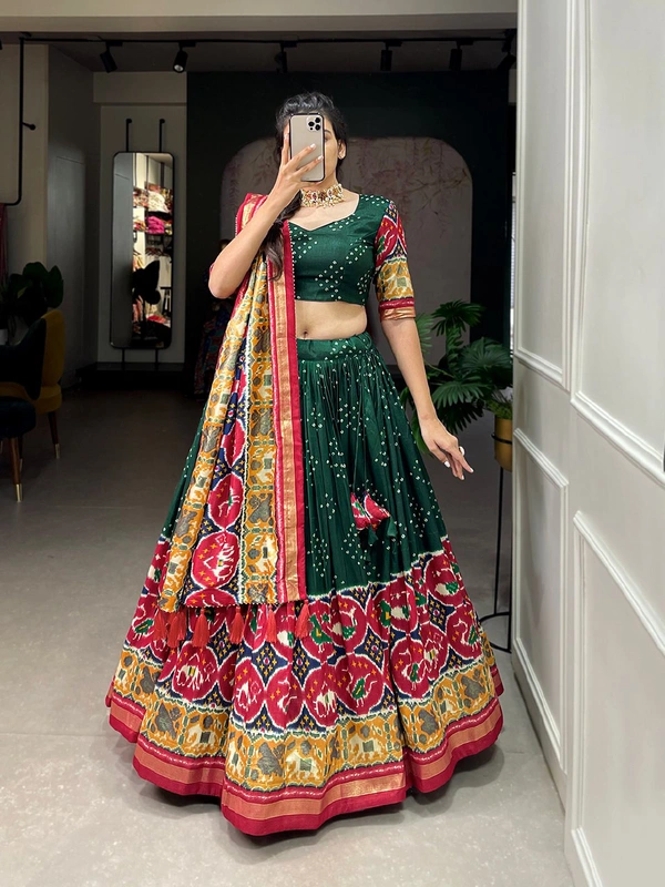 Antique Fashion 1 Step into the world of sheer Tussar Silk with Patola Print magic with these stunning lehenga! 💫 - green