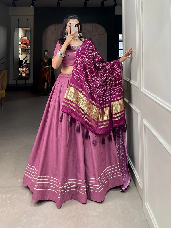 Antique Fashion  Get traditional look of your choice with this classic yet conventional plain lehenga and mirror work blouse 