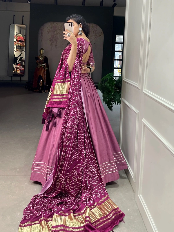 Antique Fashion  Get traditional look of your choice with this classic yet conventional plain lehenga and mirror work blouse 