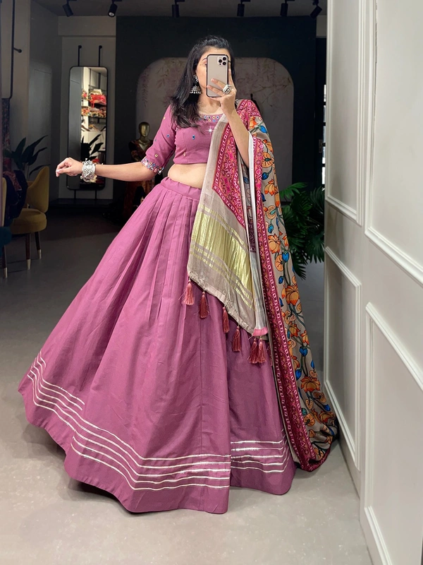 Antique Fashion  Get traditional look of your choice with this classic yet conventional plain lehenga and mirror work blouse 