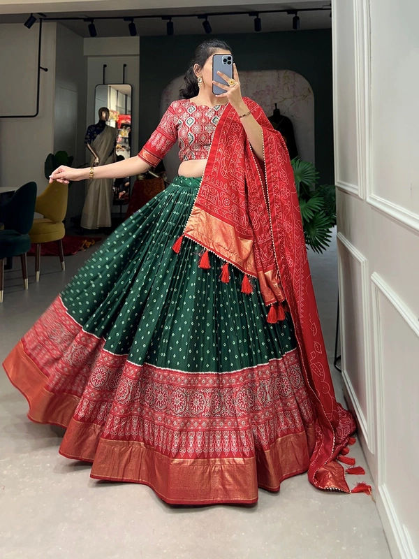 Antique Fashion  The timeless bandhani print chaniya choli showcases intricate ajrakh print and foil lacework  combining elegance and tradition in a stunning ensemble for Function  - green