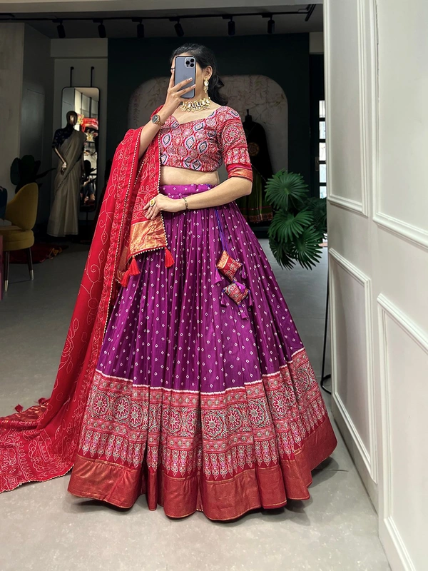 Antique Fashion  The timeless bandhani print chaniya choli showcases intricate ajrakh print and foil lacework  combining elegance and tradition in a stunning ensemble for Function  - Purple