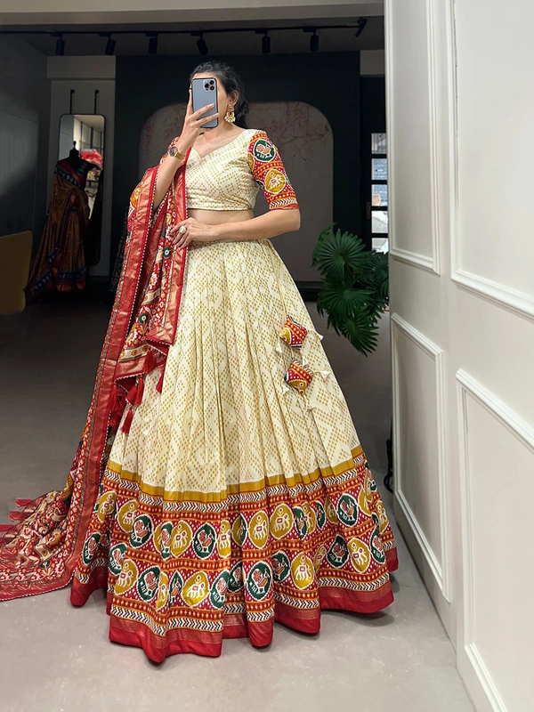 Antique Fashion 1 This beautifully printed lehengadesign going from a royal shade ensemble for function - off white