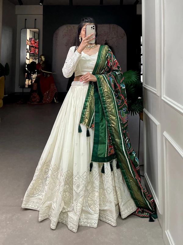 Antique Fashion  Experience timeless elegance with this beautiful lucknowi paper mirror work lehenga  - white + green