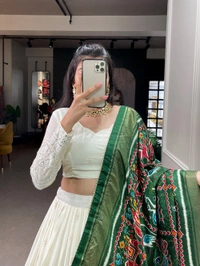 Antique Fashion  Experience timeless elegance with this beautiful lucknowi paper mirror work lehenga  - white + green