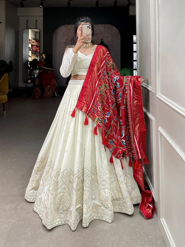 Antique Fashion  Experience timeless elegance with this beautiful lucknowi paper mirror work lehenga  - white + red