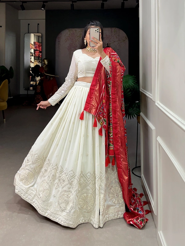 Antique Fashion  Experience timeless elegance with this beautiful lucknowi paper mirror work lehenga  - white + red