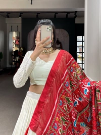 Antique Fashion  Experience timeless elegance with this beautiful lucknowi paper mirror work lehenga  - white + red