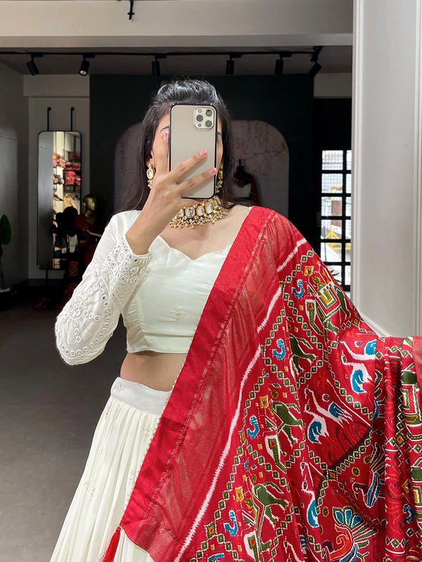 Antique Fashion  Experience timeless elegance with this beautiful lucknowi paper mirror work lehenga  - white + red