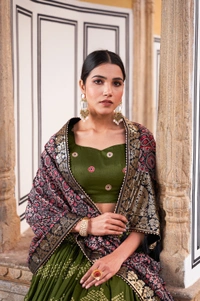 Antique Fashion 1 In the embrace of Tusser silk adorned with Ajarakh prints the lehenga choli becomes not just a garment but a reflection of tradition grace and beauty  - green