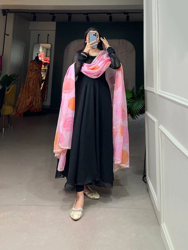 Antique Fashion 1 In the simplicity of a plain gown and the ethereal touch of an organza dupatta, elegance finds its perfect harmony. - Black
