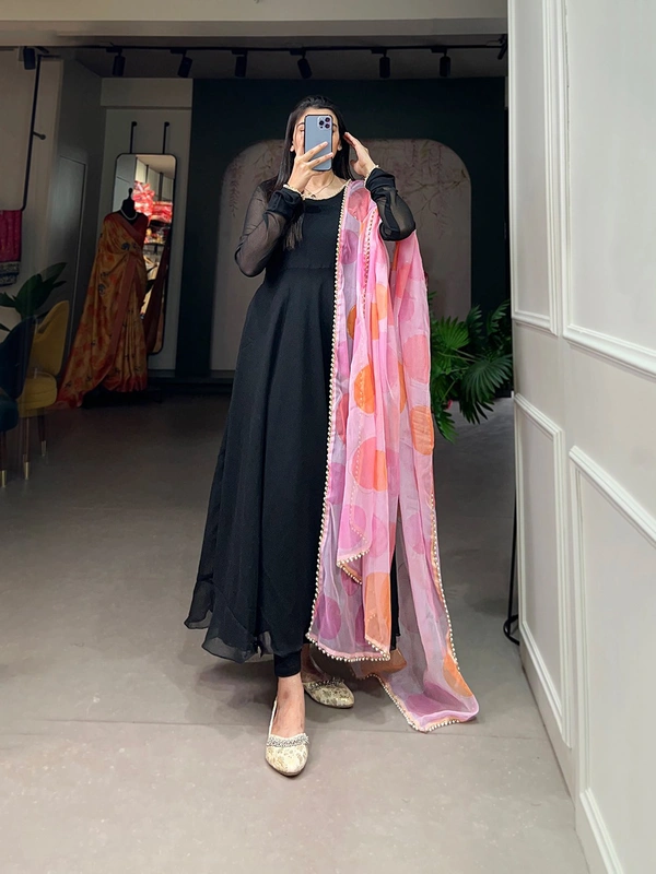 Antique Fashion 1 In the simplicity of a plain gown and the ethereal touch of an organza dupatta, elegance finds its perfect harmony. - Black