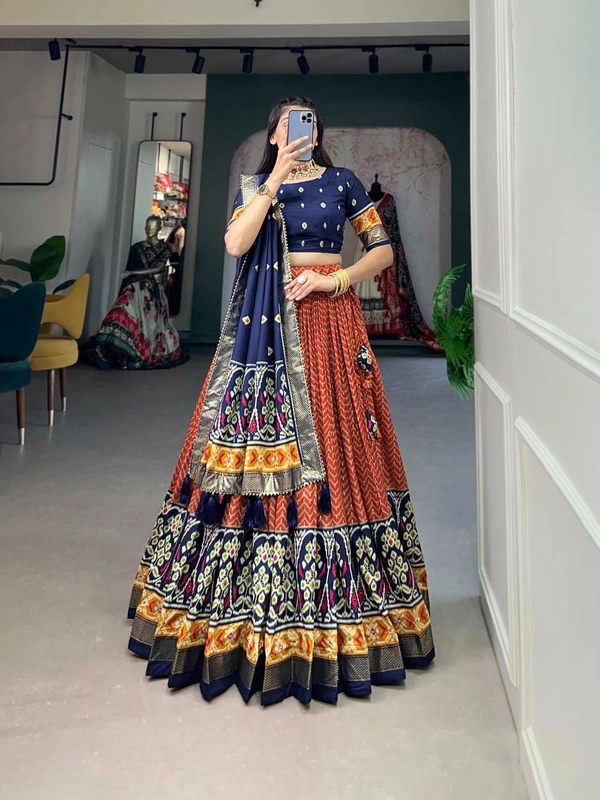Antique Fashion 1 Step into the spotlight with confidence in our Tussar silk printed lehenga choli crafted to perfection for every occasion - orange