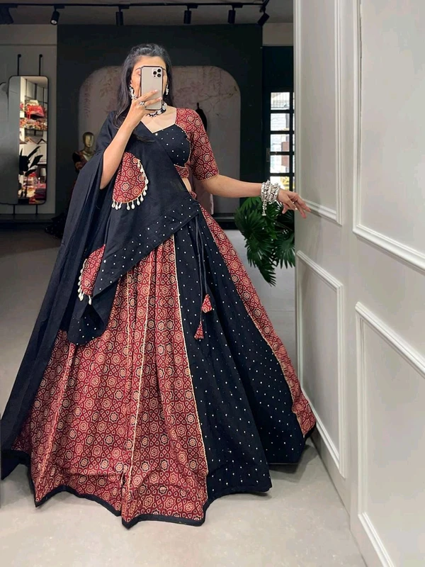 Antique Fashion  Presenting to you our latest masterpiece of Navratri collection. Dress up into this printed new maroon color and the mirror work chaniya choli  to a create your garba look more significant