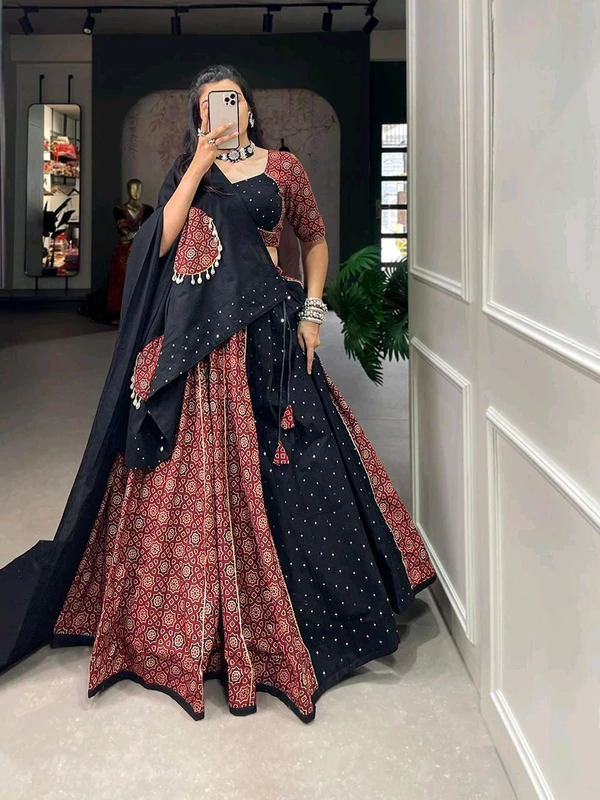 Antique Fashion  Presenting to you our latest masterpiece of Navratri collection. Dress up into this printed new maroon color and the mirror work chaniya choli  to a create your garba look more significant