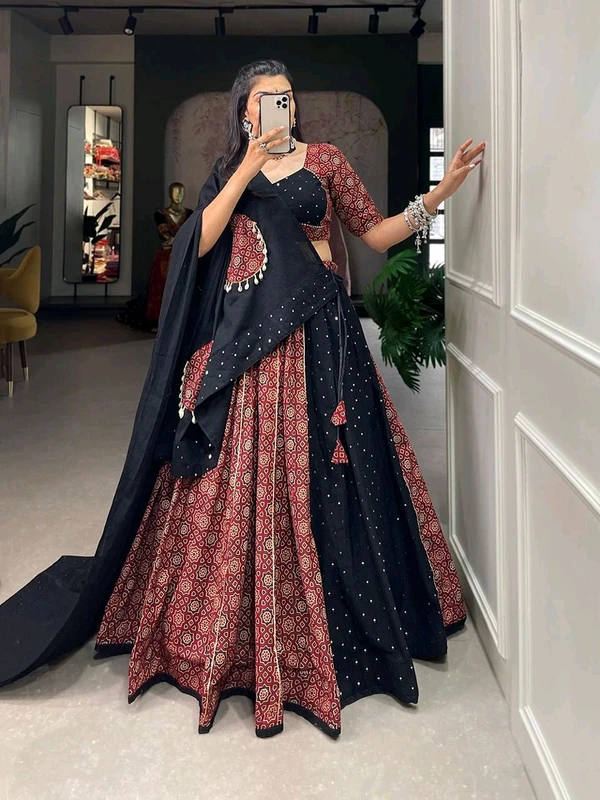 Antique Fashion  Presenting to you our latest masterpiece of Navratri collection. Dress up into this printed new maroon color and the mirror work chaniya choli  to a create your garba look more significant