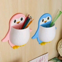 PENGUIN SHAPE WALL MOUNTED TOOTHPASTE HOLDER 