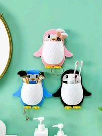 PENGUIN SHAPE WALL MOUNTED TOOTHPASTE HOLDER 