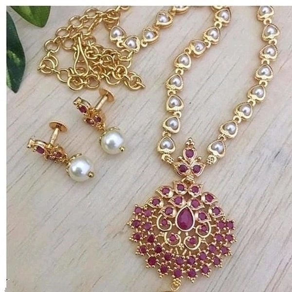 Trendy pearls work temple jewellery set, Cubic zirconia stones used in the LocketAlong with beautiful earrings pearls in hanging