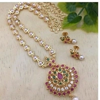 Trendy pearls work temple jewellery set, Cubic zirconia stones used in the LocketAlong with beautiful earrings pearls in hanging