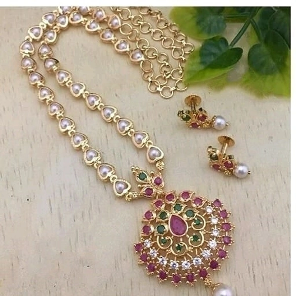 Trendy pearls work temple jewellery set, Cubic zirconia stones used in the LocketAlong with beautiful earrings pearls in hanging