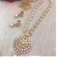 Trendy pearls work temple jewellery set, Cubic zirconia stones used in the LocketAlong with beautiful earrings pearls in hanging