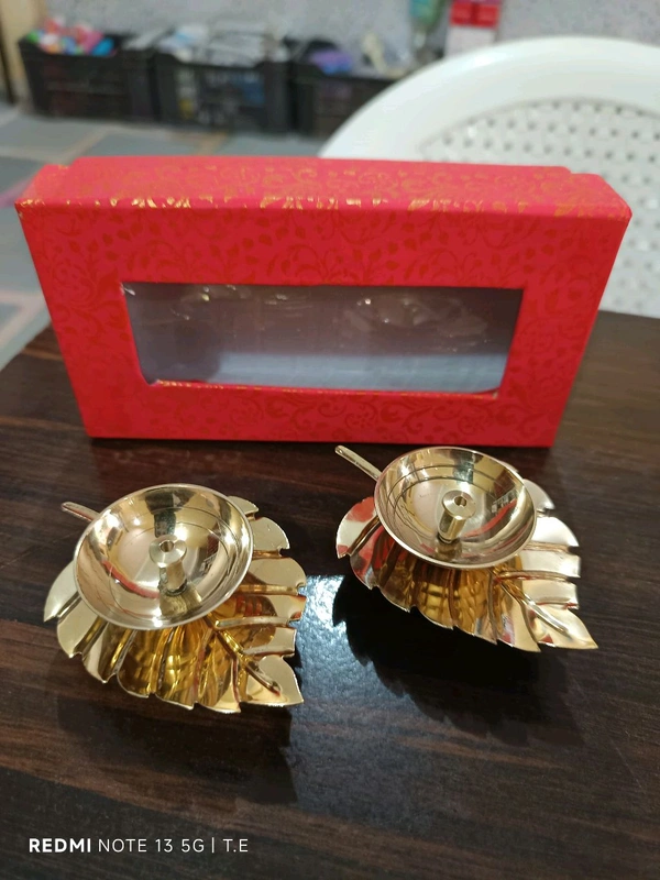 Golden leaf diya pair
