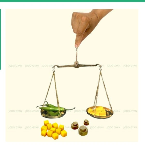 Hand-held measuring balance for understanding weight.