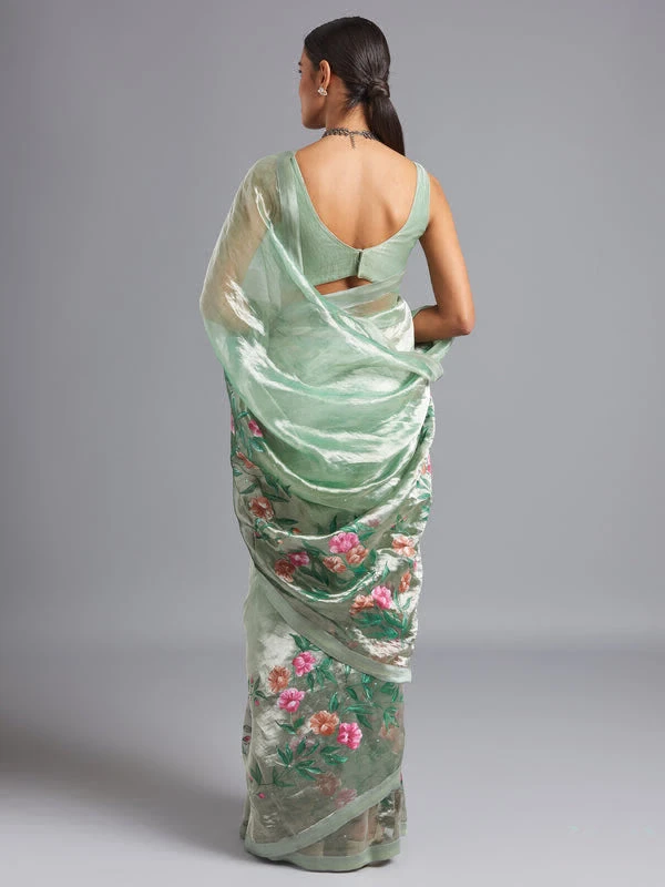 Green ombré on a silver silk tissue saree with hand-painted and embroidered details.