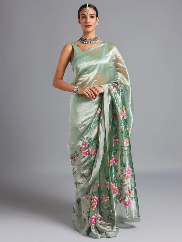 Green ombré on a silver silk tissue saree with hand-painted and embroidered details.