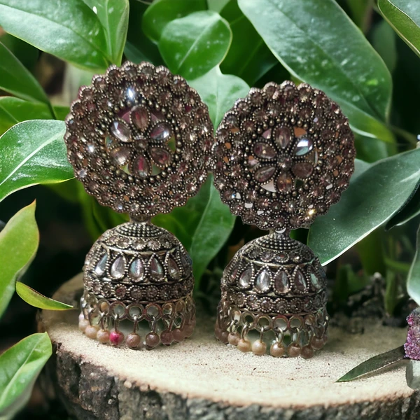 Fancy earringsBase Metal : Brass & CopperPlating : Oxidised SilverSizing : AdjustableStone Type : Artificial StonesType : JhumkhasNet Quantity (N) : 1EarringsCountry of Origin : India