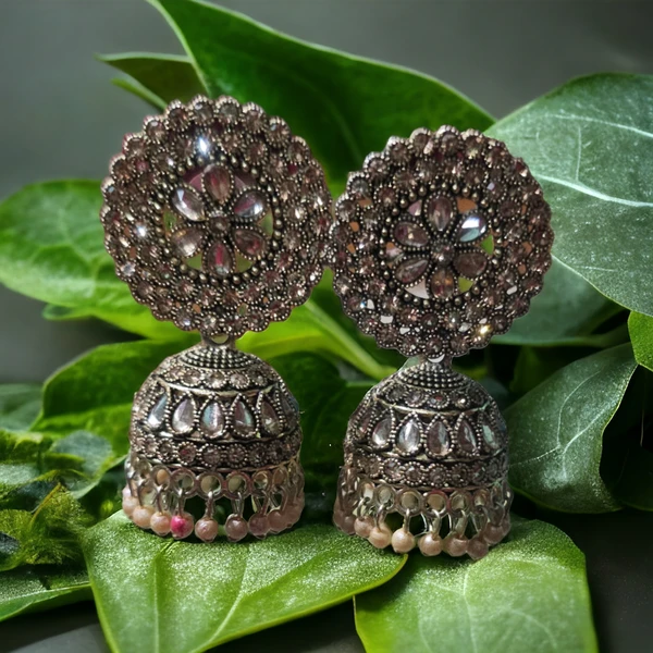 Fancy earringsBase Metal : Brass & CopperPlating : Oxidised SilverSizing : AdjustableStone Type : Artificial StonesType : JhumkhasNet Quantity (N) : 1EarringsCountry of Origin : India