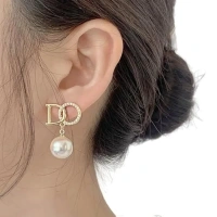 Elegant Golden 'D-O' Statement Earrings With Hanging Pearls - A Perfect Blend Of Luxury, Style, And Sophistication For Every Occasion" - free size, golden