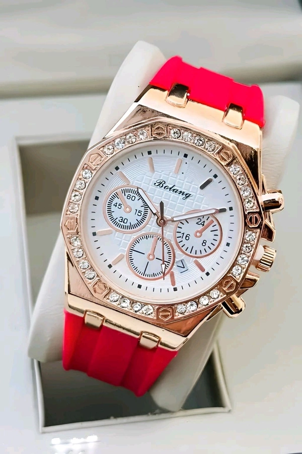 Bolang Luxe Rose Chronograph Watch!!
~ Elevate your style with the Bolang Luxe Rose Chronograph, a perfect blend of elegance and functionality. Featuring a rose gold-tone bezel adorned with sparkling crystals and a vibrant red silicone strap, this watch is designed for those who appreciate bold sophistication.  - Red