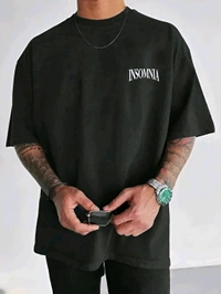 Insomnia Paradise Tee
The Insomnia Paradise Tee is where raw street energy meets bold visual storytelling. Featuring a powerful monochrome balaclava graphic and impactful typography, this oversized black shirt challenges the norms with its rebellious attitude and aspirational message: “Never stop dreaming." Ideal for those who find inspiration in chaos and style in self-expression. - Black, S
