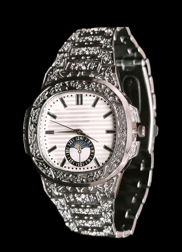 Regal Nocturne Timepiece
Elevate your style with the Regal Nocturne Timepiece – a masterfully engraved luxury watch that blends timeless elegance with bold craftsmanship. Featuring a textured dial, moonphase subdial, and intricate metalwork, this statement piece is designed for those who appreciate sophistication in every second. - Silver